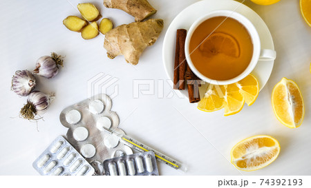 Products for the treatment of common cold - lemon, ginger, chamomile tea pills. Natural medicine vs conventional medicine Products for the treatment of common cold - lemon, ginger, chamomile tea pills. Natural medicine vs conventional medicine 74392193