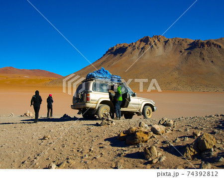 Off-road SUV with tourist on Altiplano Off-road SUV with tourist on Altiplano 74392812