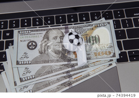 Soccer whistle on dollar banknotes. Betting on sport concept 74394419