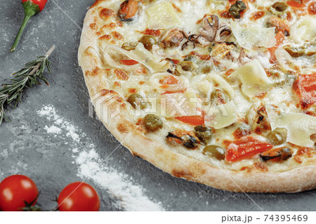 Seafood pizza. pizza with mozzarella, shrimp, octopus, squid, mussels and other seafood. 74395469