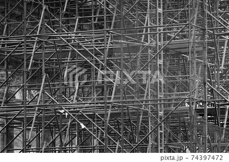 Complicated scaffolding consisting of many poles 74397472