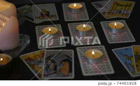 Defocused assortment of Tarot inspired cards 74401928