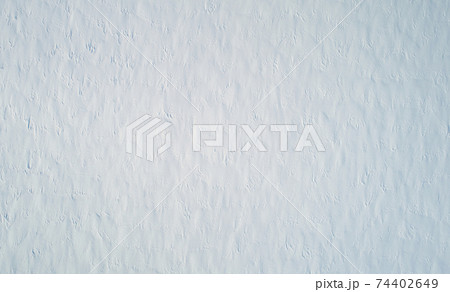 Snowy field texture background 74402649