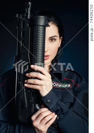 Portrait of a woman in a Russian police uniform with a rifle English translation police Portrait of a woman in a Russian police uniform with a rifle English translation police 74406250
