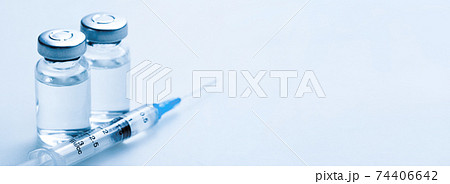 Medical syringe with a needle and a bollte with vaccine. Medical syringe with a needle and a bollte with vaccine. 74406642