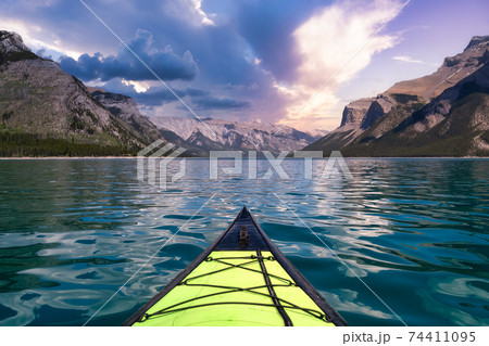 Kayaking in Lake Minnewanka. Kayaking in Lake Minnewanka. 74411095