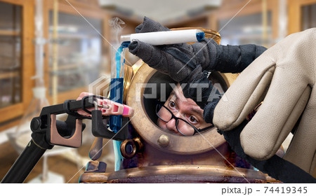 A frightened scientist pour a dangerous liquid to tube. A frightened scientist pour a dangerous liquid to tube. 74419345