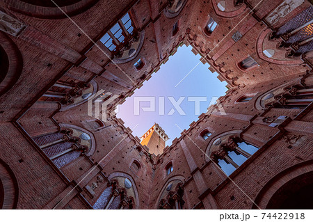 View from the courtyard of Palazzo Pubblico to the Torre del Mangia. Siena, Tuscany, Italy 74422918