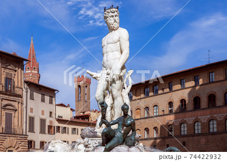 Famous Fountain of Neptune on the background of a beautiful blue sky. Florence, Italy 74422932