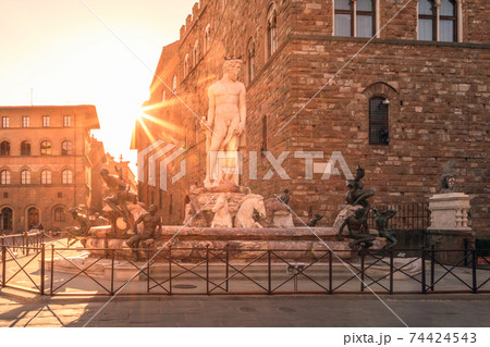 Fountain of Neptune on Piazza della Signoria in the rays of the rising sun in Florence, Italy Fountain of Neptune on Piazza della Signoria in the rays of the rising sun in Florence, Italy 74424543