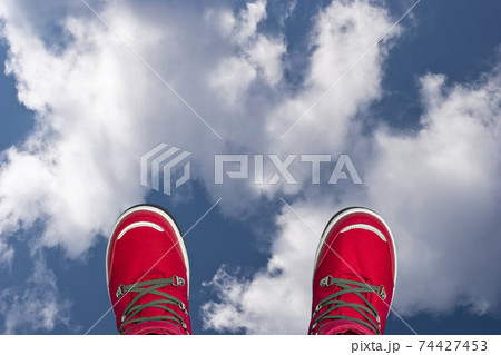 Kids or teenage pink winter boots isolated on blue sky background. Winter boots for girls. Top view banner Kids or teenage pink winter boots isolated on blue sky background. Winter boots for girls. Top view banner 74427453
