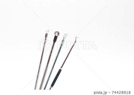 Tools for removing black spots and acne on the skin isolated on white background 74428918