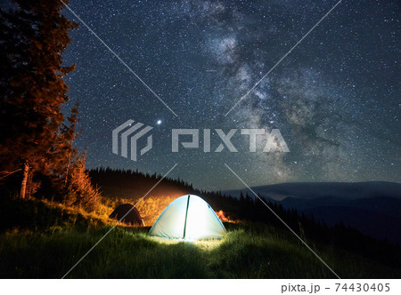 Night camping under mountain starry sky. Night camping under mountain starry sky. 74430405