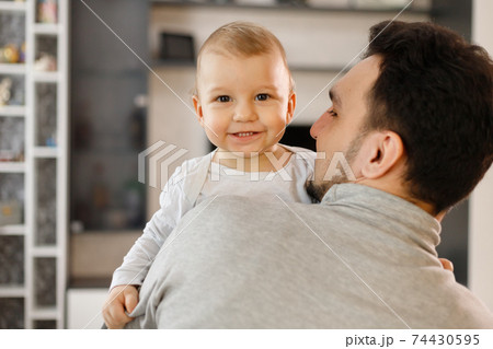 Infant baby and father. Son and dad Infant baby and father. Son and dad 74430595