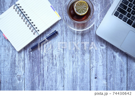 flat composition of laptop and office stationary on black desk  74430642