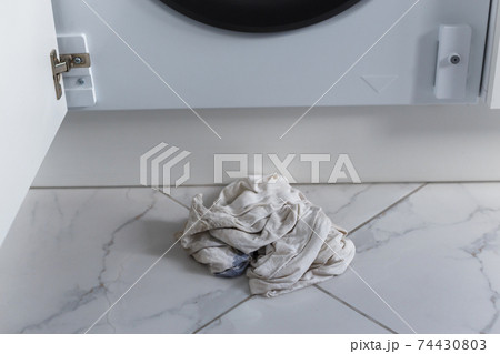 Rags for absorbing spilled water leaked from washing machine built into the kitchen furniture 74430803