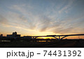 足立区と荒川区を繋ぐ扇大橋を渡る舎人線と富士山と荒川遊園地の観覧車の観える冬の夕暮れの風景　 74431392