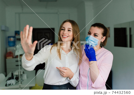 Female manicure master in a beauty salon work with hands of the client 74432560