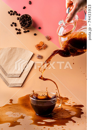 pouring coffee in a cup pouring coffee in a cup 74433913