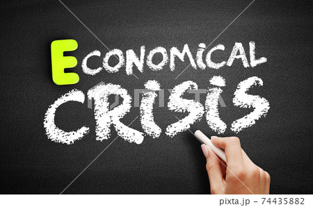 Hand writing Economical crisis on blackboard, concept background 74435882