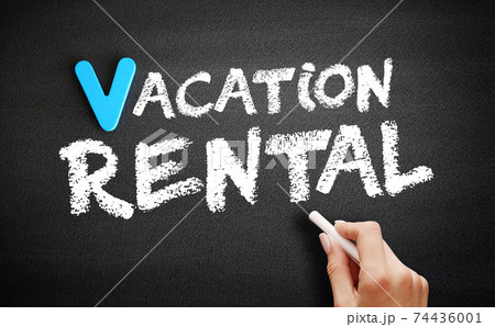 Vacation rental text on blackboard, concept background 74436001
