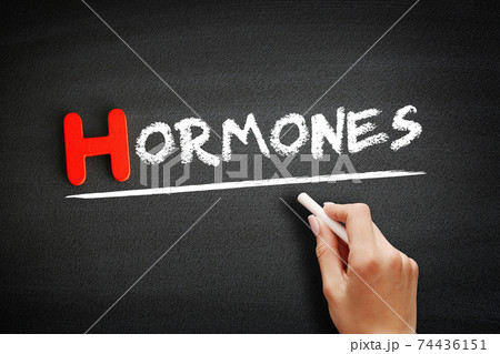 Hand writing Hormones on blackboard, concept background 74436151