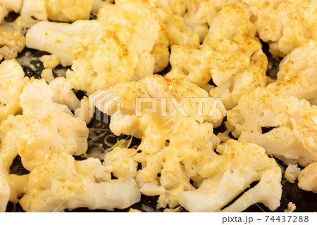 Selective focus of baked cauliflower inflorescences with cheese. Selective focus of baked cauliflower inflorescences with cheese. 74437288