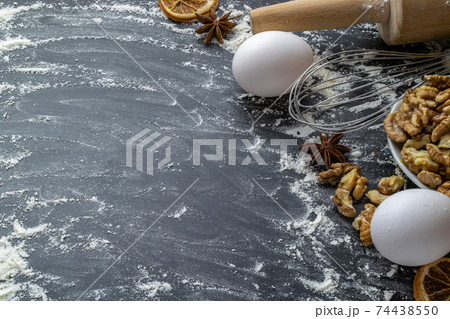 Bakery composition. Cooking food ingredients: flour, eggs, nut and star anise, orange on dark table kitchen background for cake. Top View Copy Space. Cookies Pie Or Cake Recipe Mockup. Bakery composition. Cooking food ingredients: flour, eggs, nut and star anise, orange on dark table kitchen background for cake. Top View Copy Space. Cookies Pie Or Cake Recipe Mockup. 74438550