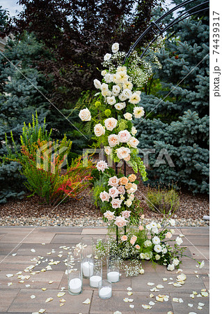 fragment an arch of live flowers for an outdoor wedding ceremony.making holidays 74439317