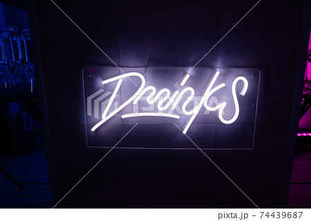 drinks. neon LED inscription on the bar.  74439687