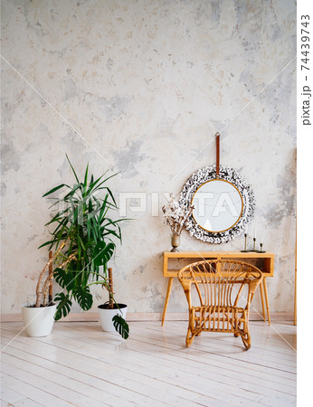 Loft interior. braided chair at the make-up table with a mirror 74439743