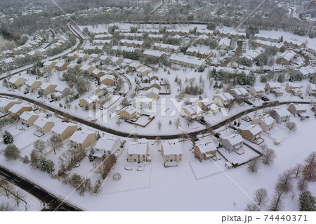 The winter aerial view of small town residential courtyards houses covered snow The winter aerial view of small town residential courtyards houses covered snow 74440371
