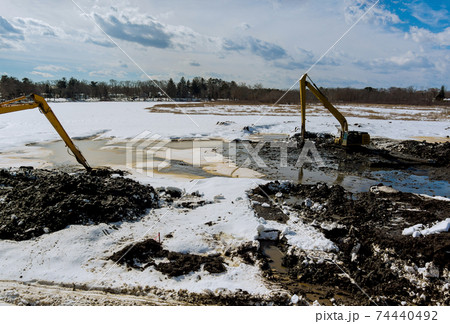 Backhoe the digging pit for construct building excavators during earthworks at construction Backhoe the digging pit for construct building excavators during earthworks at construction 74440492