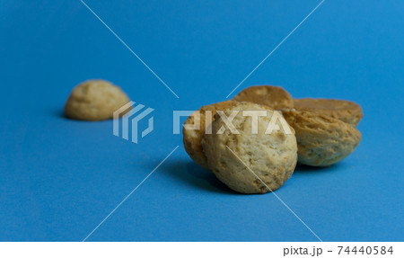 Closeup round butter biscuits. Cookies on a colored background. Dessert, sweetness, lunch Closeup round butter biscuits. Cookies on a colored background. Dessert, sweetness, lunch 74440584