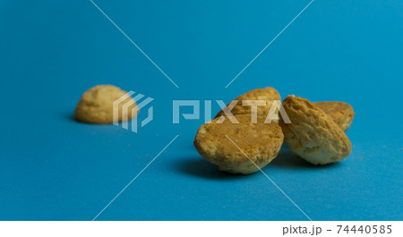 Closeup round butter biscuits. Cookies on a colored background. Dessert, sweetness, lunch Closeup round butter biscuits. Cookies on a colored background. Dessert, sweetness, lunch 74440585