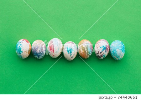 easter colored eggs on a green background easter colored eggs on a green background 74440661