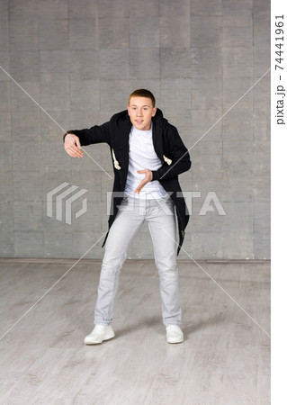 Young rapper on studio bakground. Young rapper on studio bakground. 74441961