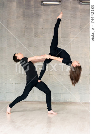 Young couple of dancers in modern dance. Young couple of dancers in modern dance. 74442139