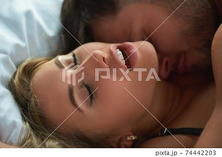 Face of woman in bed. 74442203