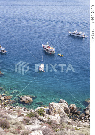 View of the Tremiti Islands. Boats near a rock stone coast. View of the Tremiti Islands. Boats near a rock stone coast. 74443015