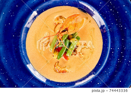 Tasty cream soup with crayfish. 74443336