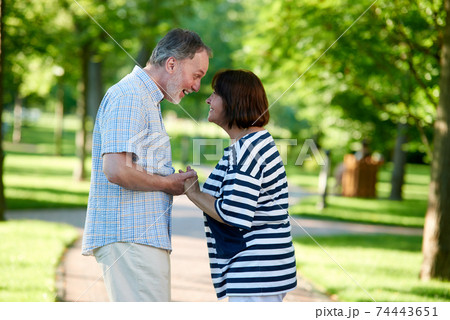 Happy mature wife and husband outdoors. 74443651