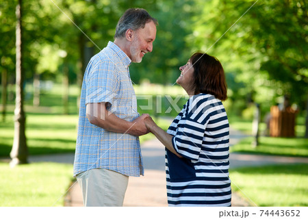 Smiling caucasian couple looking at each other. Smiling caucasian couple looking at each other. 74443652