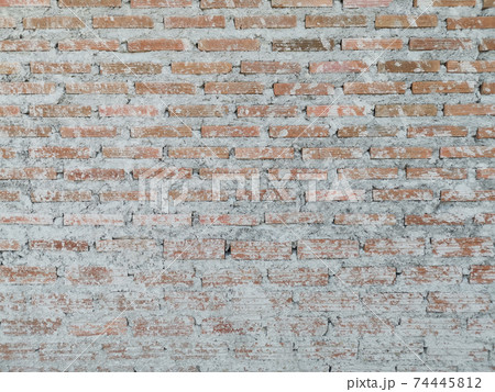 A red brick wall. The bare walls are not plastered on the surface. 74445812