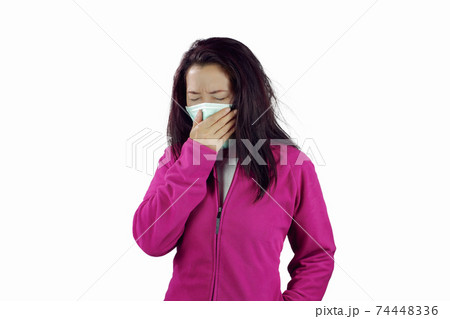 Woman wearing a flu mask Woman wearing a flu mask 74448336