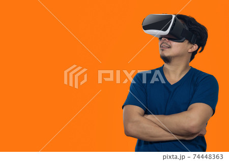 Young man with virtual reality headset. Young man with virtual reality headset. 74448363
