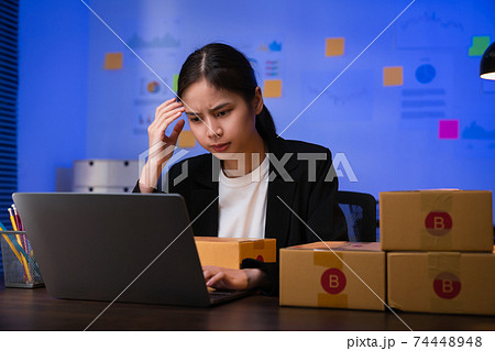 young woman owner hands touch on the forehead have a headache because of stress. young woman owner hands touch on the forehead have a headache because of stress. 74448948