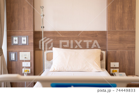 Empty sick bed for supporting patients at hospital room Empty sick bed for supporting patients at hospital room 74449833