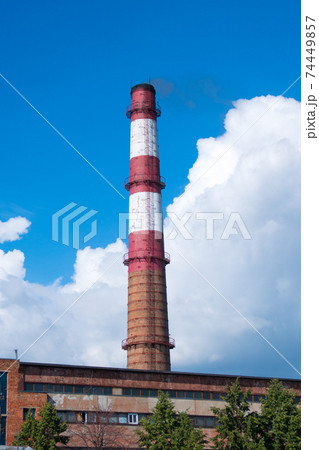 old power station chimney with deep blue sky background old power station chimney with deep blue sky background 74449857