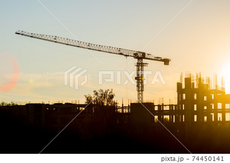 building construction site and crane in deep evening 74450141